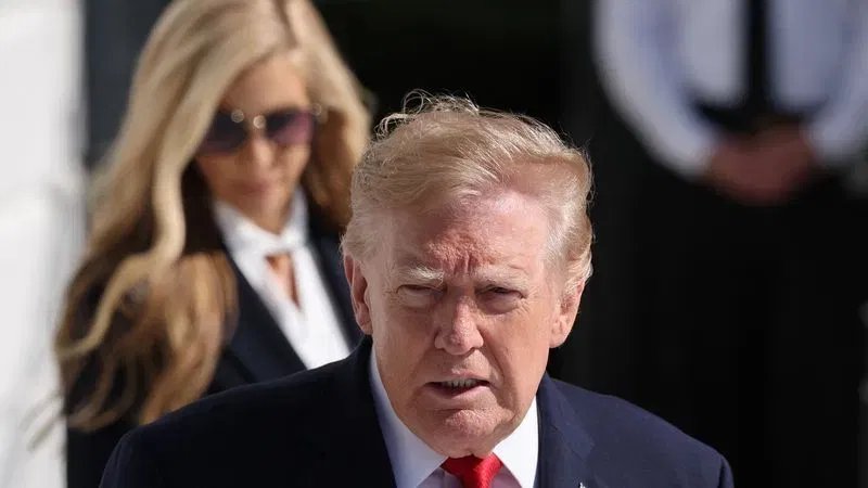 WASHINGTON, DC - OCTOBER 13: U.S. President Donald Trump is followed by White House Press Secretary Katie Zacharia (L) as he departs on the South Lawn of the White House on October 13, 2026 in Washington, DC. President Trump is traveling to Alaska to headline a rally for incumbent Sen. Dan Sullivan (R-AK), who will be facing off against Alaska Democratic Senate candidate, former Rep. Mary Peltola in the midterm elections. (Photo by Win McNamee/Getty Images)