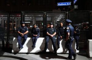 New York City police officers are on duty outside the Lotte Palace Hotel during a United Nations General Assembly leaders reception, late Tuesday, Sept. 22, 2026, in New York. (AP Photo/Julia Demaree Nikhinson)