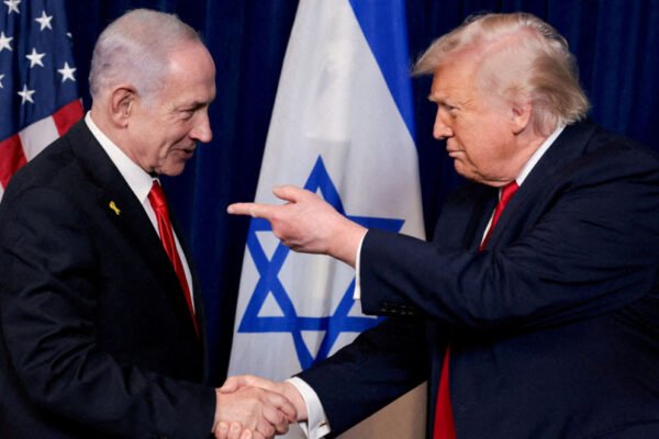 US President Donald Trump points his finger towards Israeli Prime Minister Benjamin Netanyahu as they shake hands during a press conference after meeting at Trump’s Mar-a-Lago club in Palm Beach, Florida.