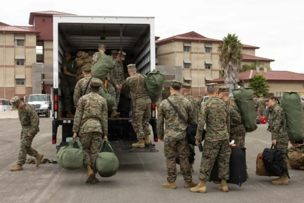 US Marines assigned to the 13th Marine Expeditionary Unit, load their gear into a box truck at Marine Corps Base Camp Pendleton, California, Sept. 26, 2026.