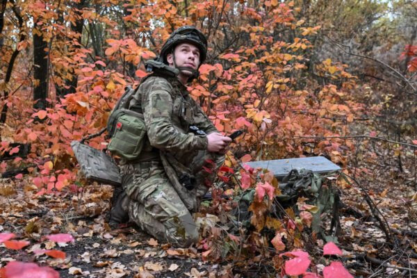 An artilleryman of the Special Rifle Police Battalion of Zaporizhzhia region sets up Starlink satellite internet system, at a position, amid Russia's attack on Ukraine, near the frontline in Donetsk region, Ukraine, October 16, 2026.