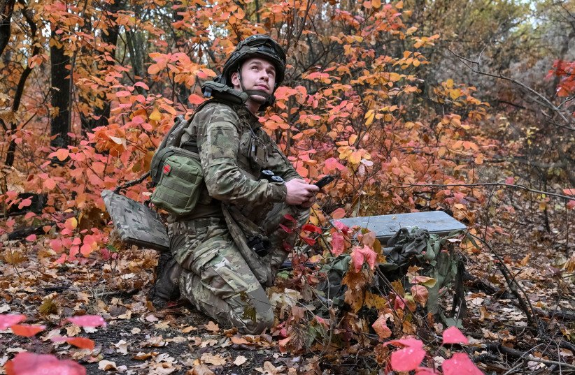 An artilleryman of the Special Rifle Police Battalion of Zaporizhzhia region sets up Starlink satellite internet system, at a position, amid Russia's attack on Ukraine, near the frontline in Donetsk region, Ukraine, October 16, 2026.
