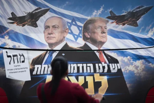 An election campaign poster featuring Israeli Prime Minister and Likud party chairman Benjamin Netanyahu alongside US President Donald Trump is displayed on the back of a bus in Jerusalem, ahead of Israel’s upcoming general elections, October 25, 2026.