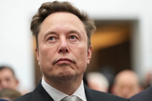 Elon Musk listens as President Donald Trump speaks during an event at the U.S. Institute of Peace, October 8, 2026, in Washington. | AP Photo/Julia Demaree Nikhinson, File
