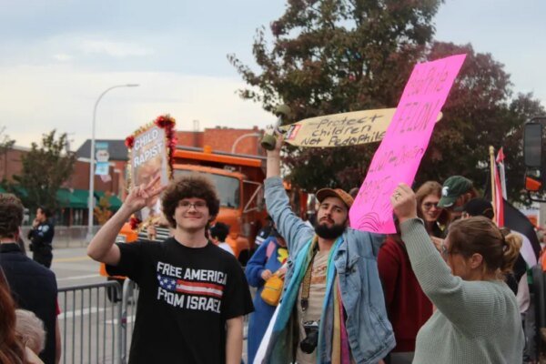 Protesters denounce President Trump as a ‘felon’ and ‘pedophile’ at a protest outside his rally in Port Huron, Michigan