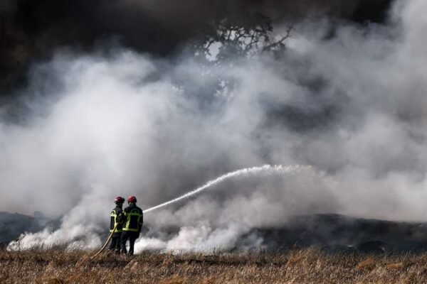 French firefighters work to extinguish a fire near a farm in France. (Photo: Reuters)