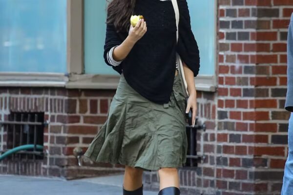 Olivia Rodrigo takes a casual stroll in New York City while eating an apple.