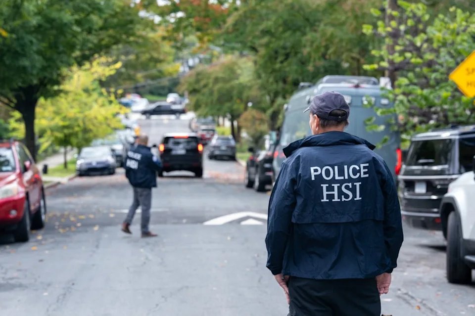 Homeland Security Investigations officers are shown during the search of Democratic Congresswoman Ilhan Omar's home on October 12 in the Washington, D.C.-area.