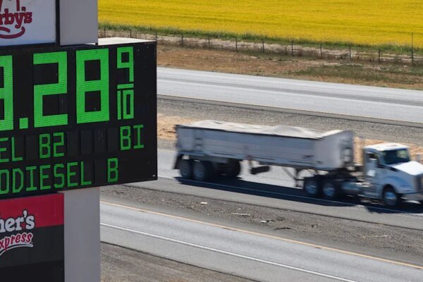 A semi drives past a sign advertising the price of diesel along Interstate 5 in Williams, California, U.S., September 28, 2026. REUTERS/Fred Greaves